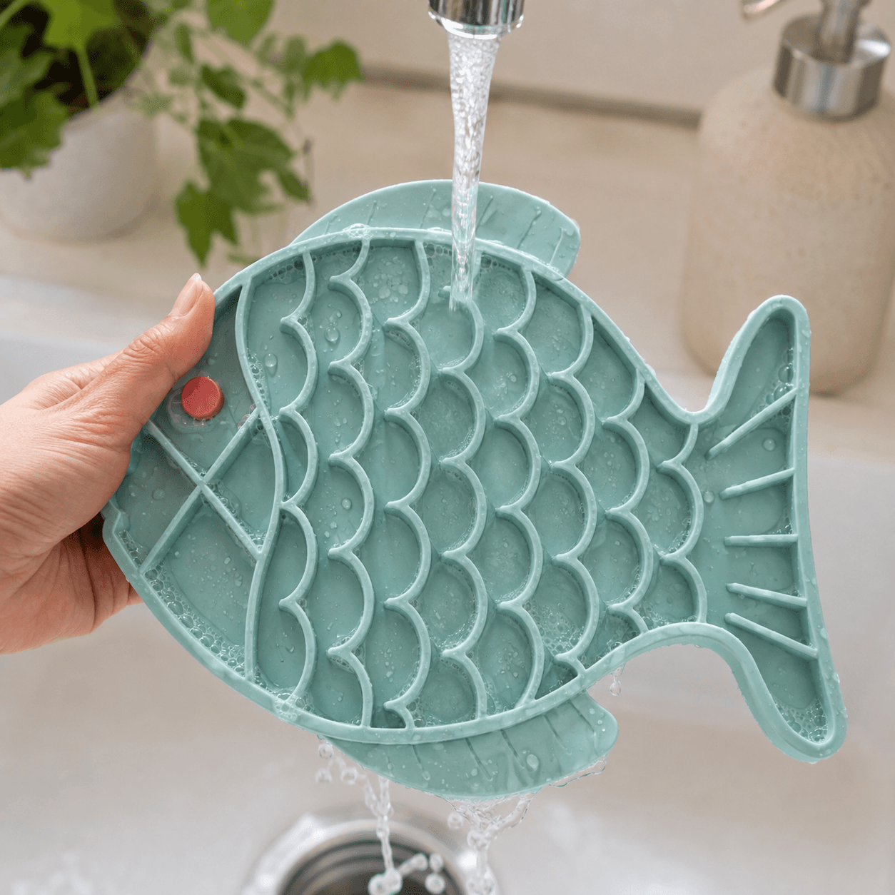The Soothe Mat being cleaned after use